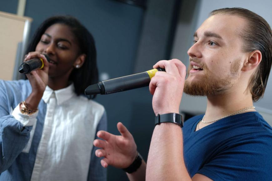 students singing duet